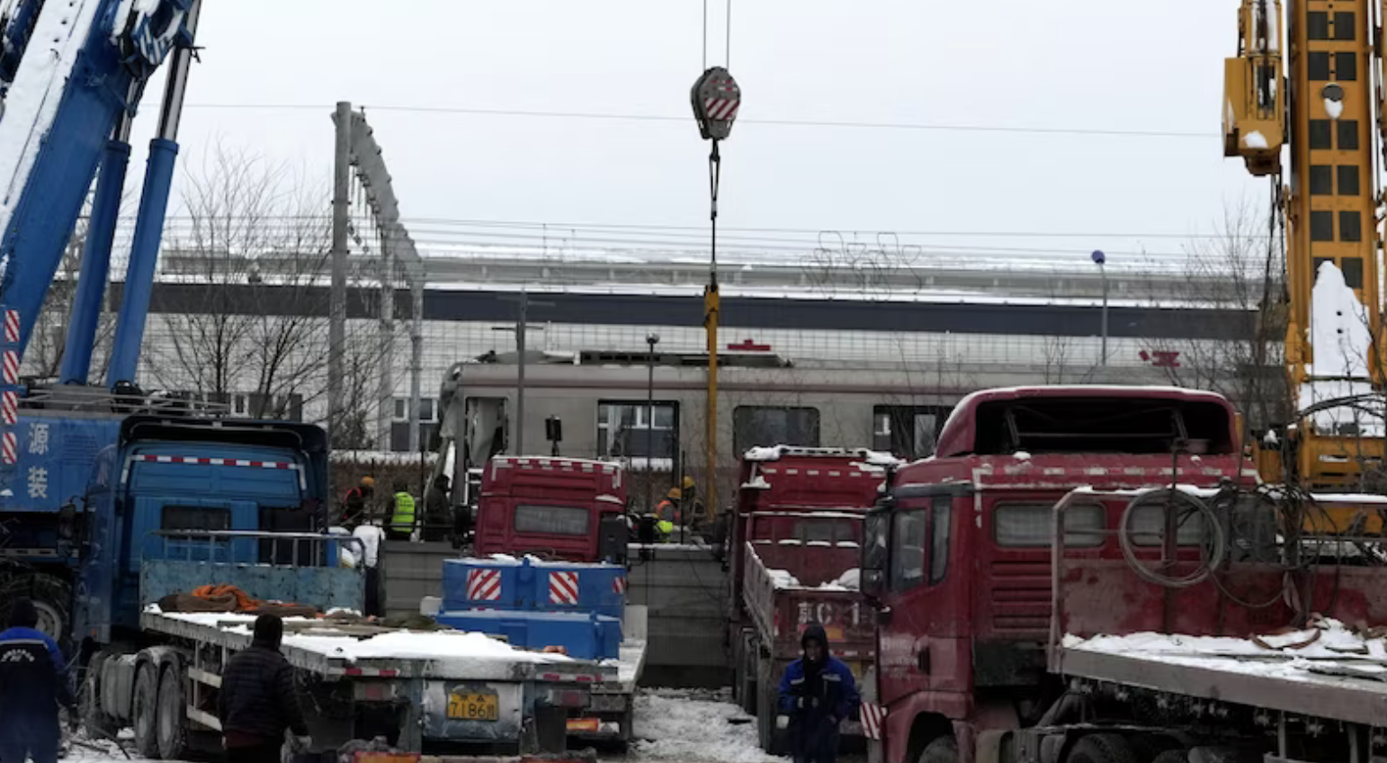 Beijing train crash sends hundreds to hospital as China hit by heavy snow and freezing temperatures